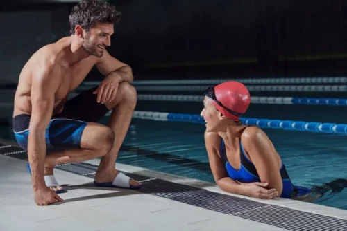 man and woman talk at swimming pool