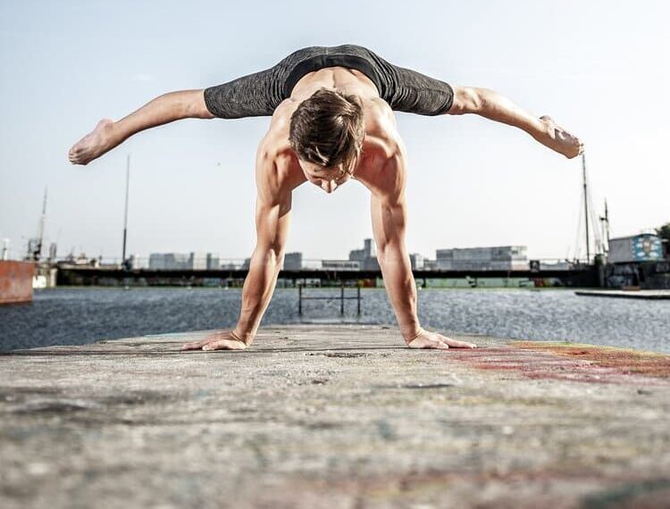 Man performing hand stand