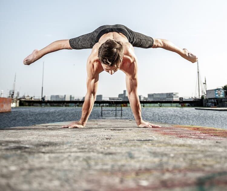 Man performing hand stand