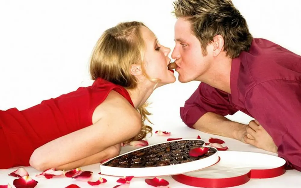 Couple kiss with chocolate
