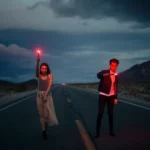 couple in road with firelights
