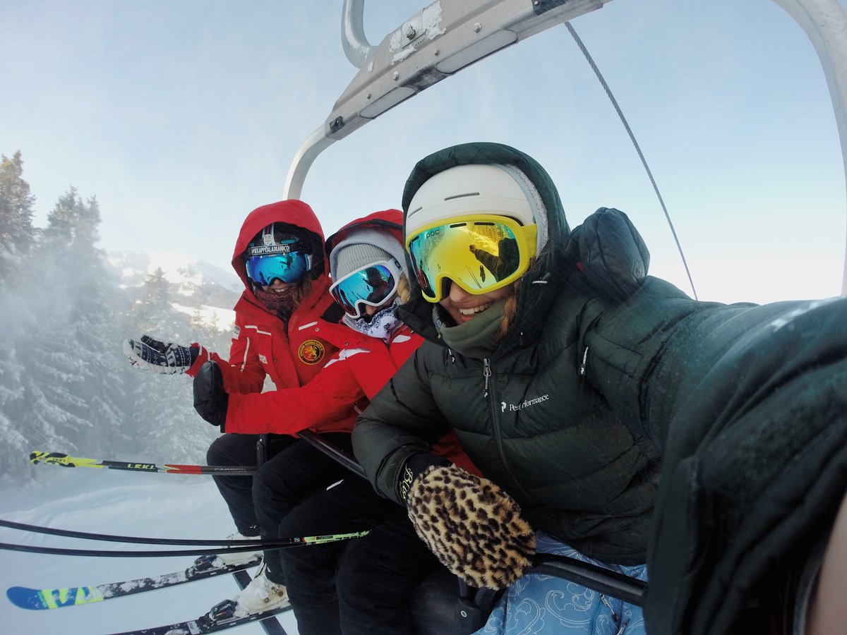 Skiiers in cable car