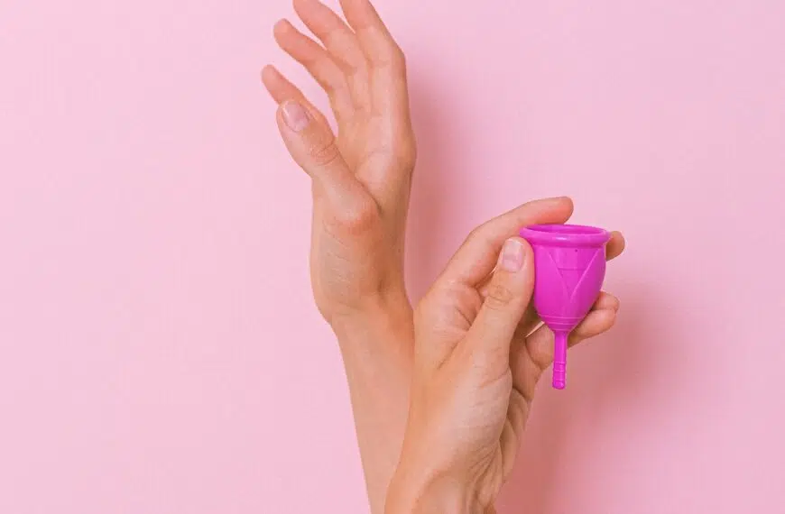 hands hold up menstrual cup