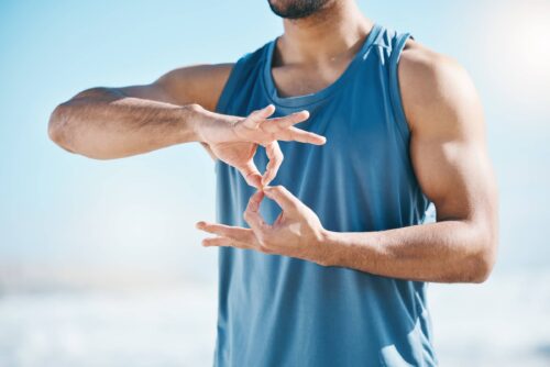 Hands, exercise and sign language with a sports man outdoor