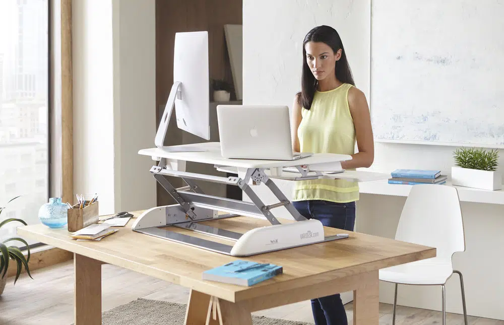 Womanstandingatvaridesk