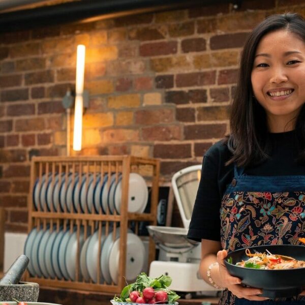 woman holding bowl of food e1673796968557