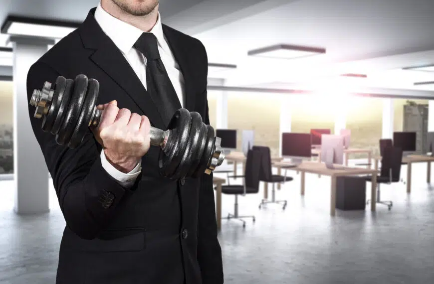 businessman in modern office wheightlifting power
