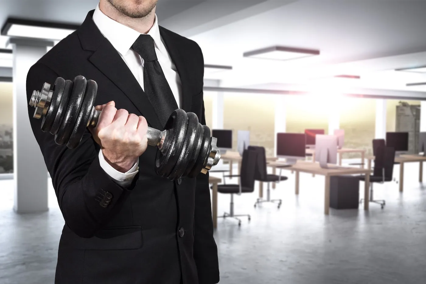 businessman in modern office wheightlifting power