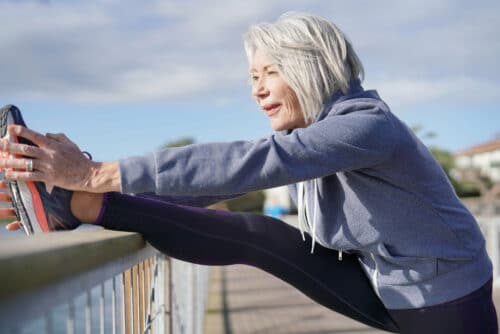 old woman stretching