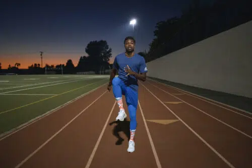 Man excercises on track 1