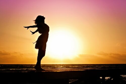 woman with sun in background