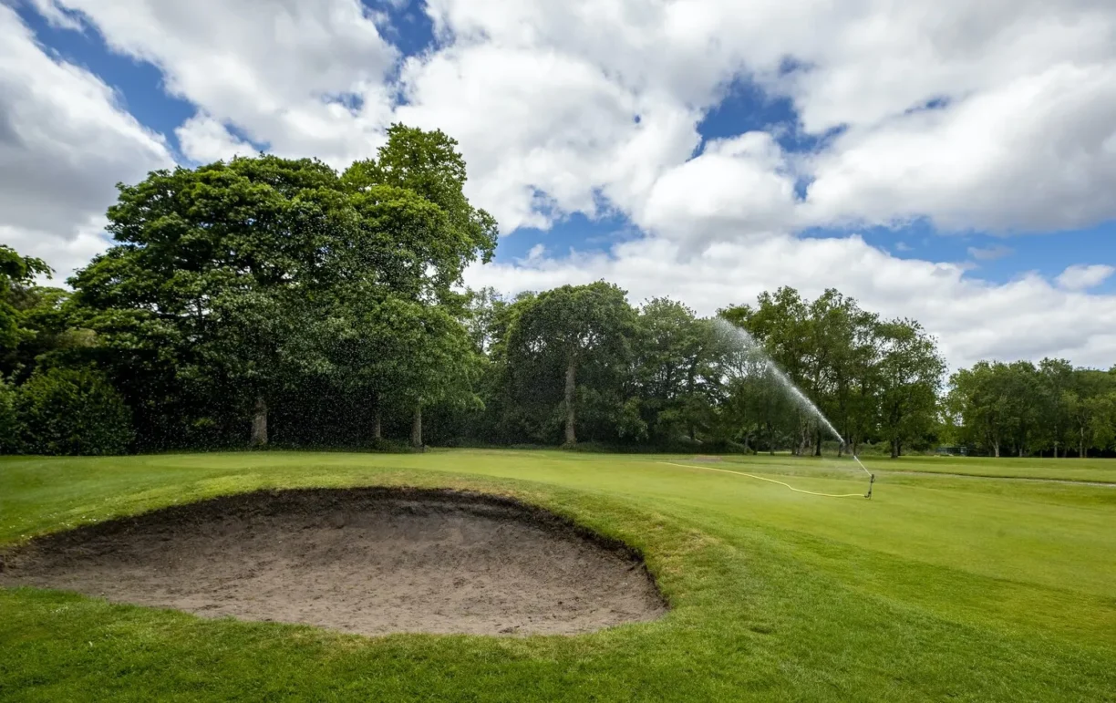 golf bunker being watered