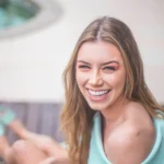 1 woman wearing teal off shoulder dress 1776862