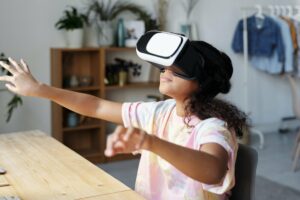 girl in white and pink shirt wearing white vr goggles 4144041
