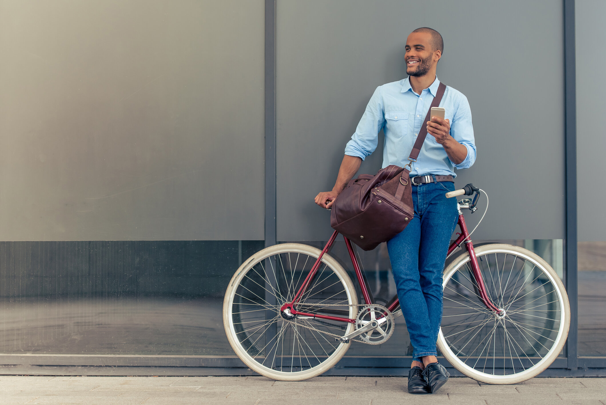 manstandingnexttohisbike