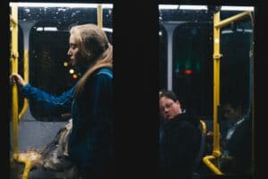 photo of a woman standing inside bus 808700