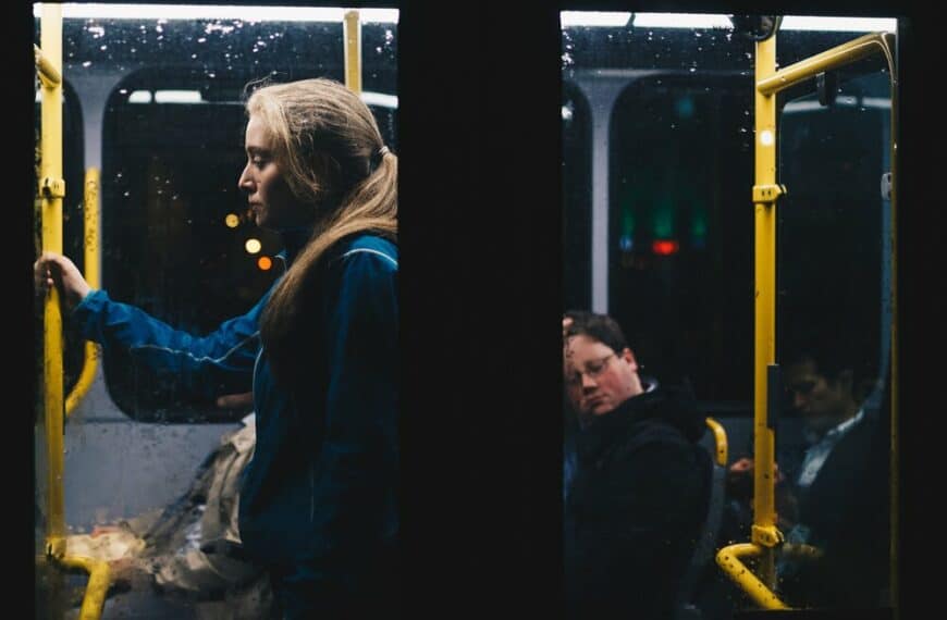 photo of a woman standing inside bus 808700