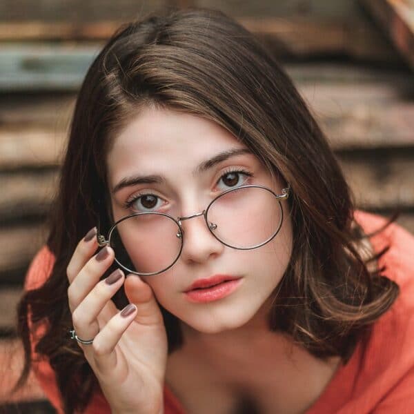 sitting woman wearing eyeglasses