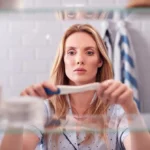 womancheckingpregnancytest