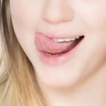 womanlickingtoplip