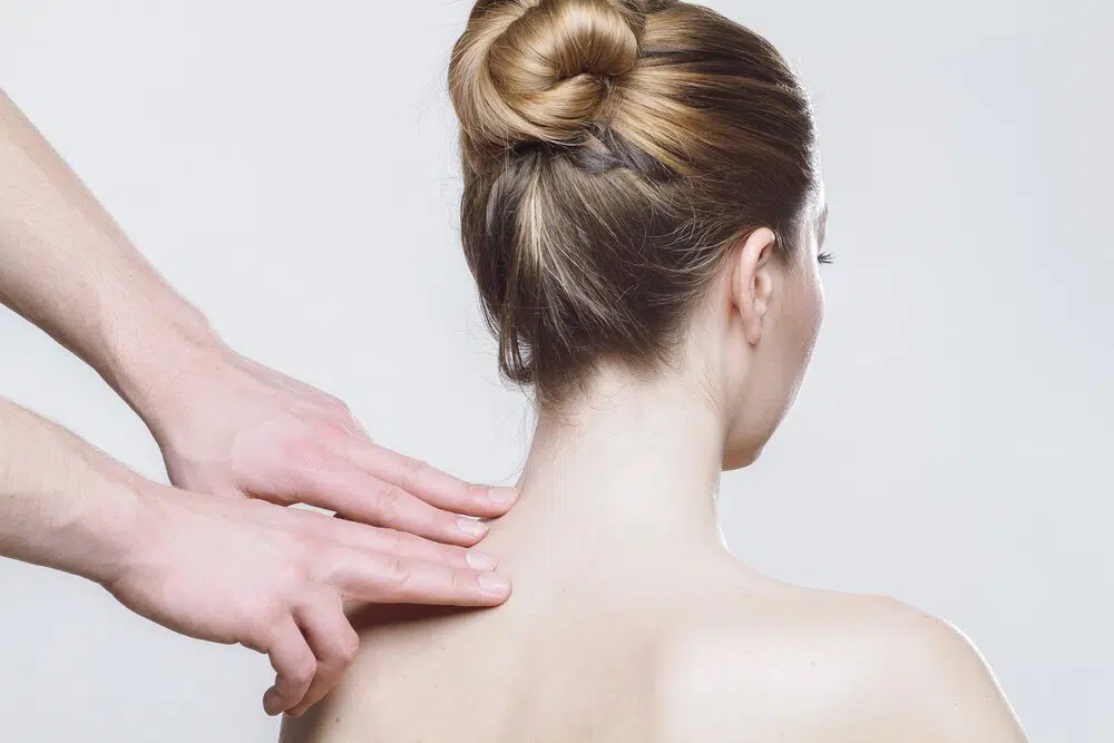 Womanwithhandsonback