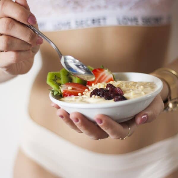 fit female eating from a bowl