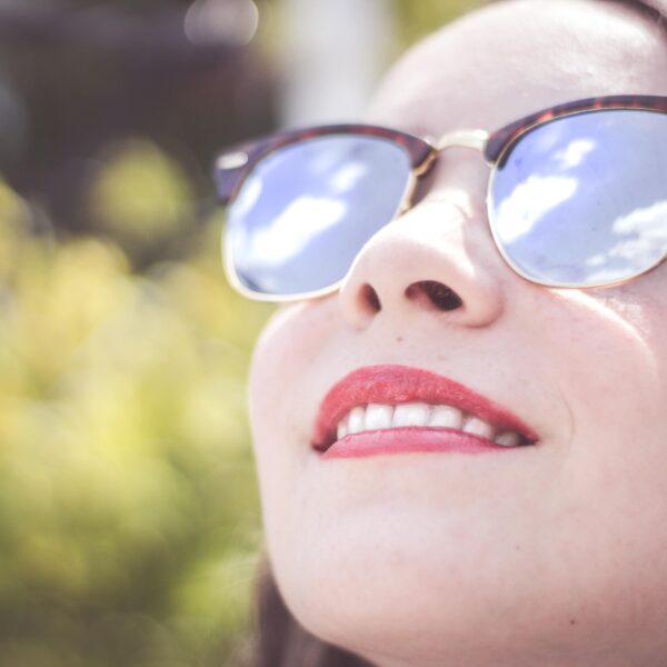 woman wearing blue framed sunglasses scopio d767622c 36c2 44f8 b754 1e3644b51253 scaled