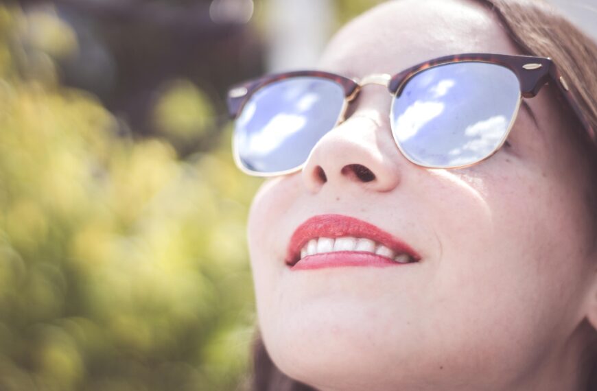 woman wearing blue framed sunglasses scopio d767622c 36c2 44f8 b754 1e3644b51253 scaled