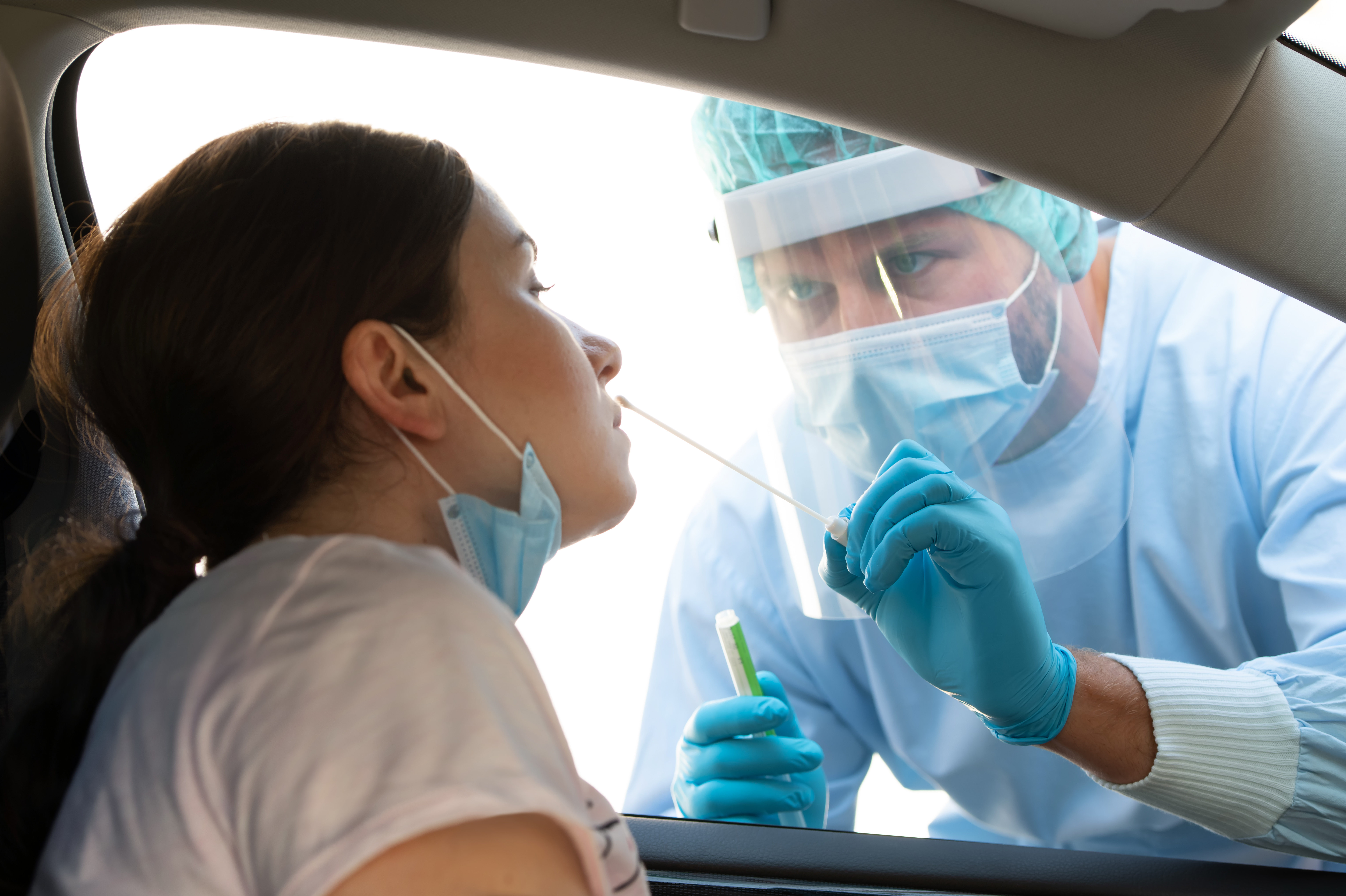 Woman getting tested at a coronavirus drive thru station copy
