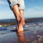 feet wallking in the sea scaled
