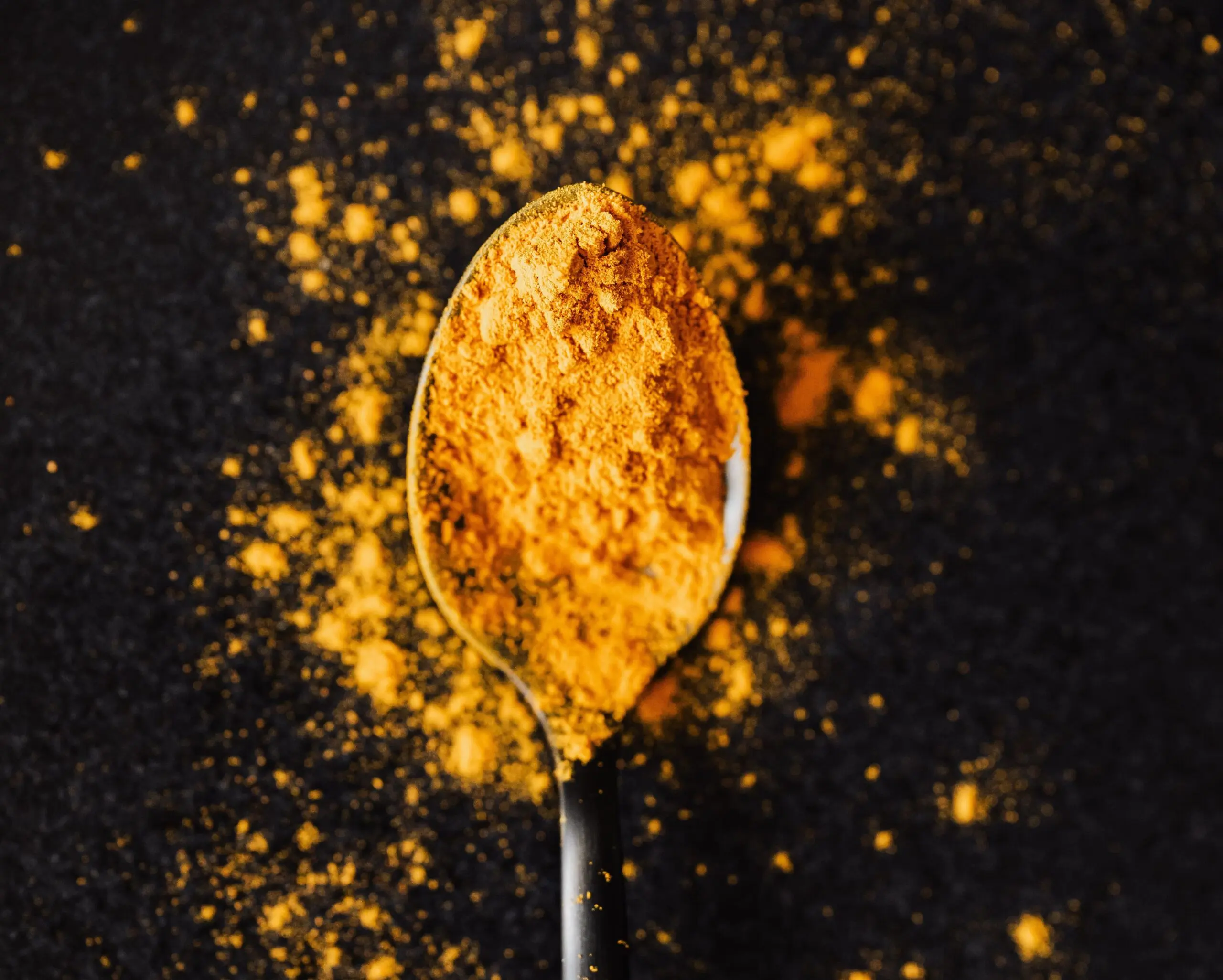Turmeric exploding on spoon scaled