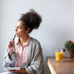 woman contemplating scaled