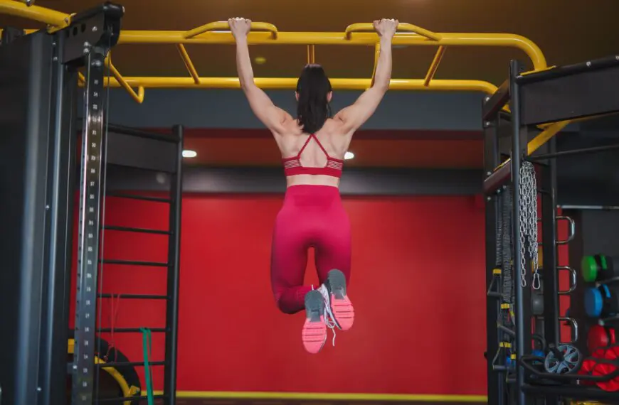 woman doing pull ups on rig scaled