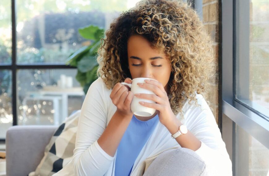 woman drinks from cup scaled