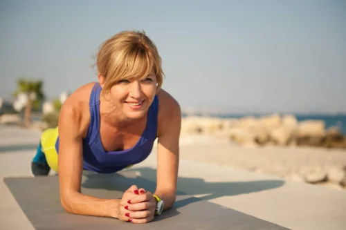 woman holding a plank scaled