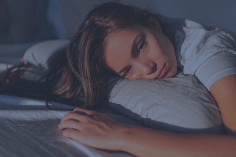 woman laying trying to sleep 1