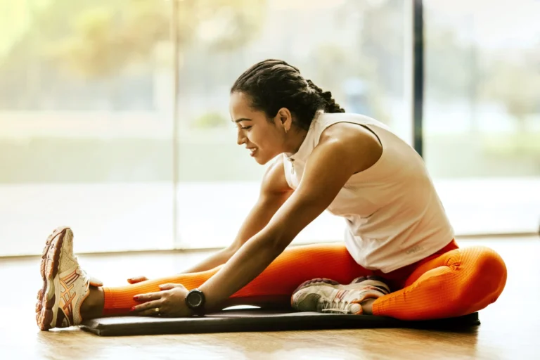 woman stretches leg