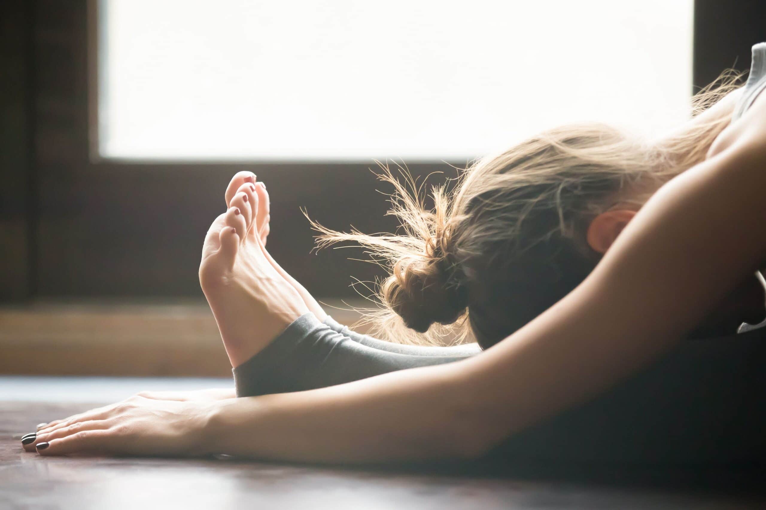 woman stretches scaled