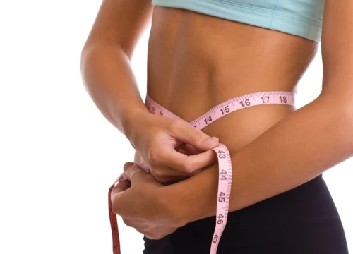 woman with tape measure on waist scaled