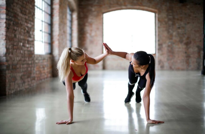 women high five whilst planking scaled
