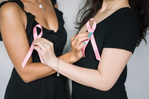 women holding pink ribbons scaled
