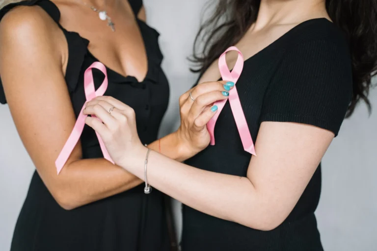 women holding pink ribbons scaled