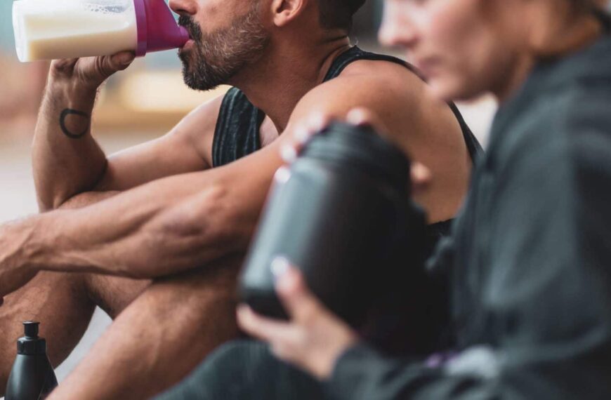 couple drink protein shakes scaled e1626535916445
