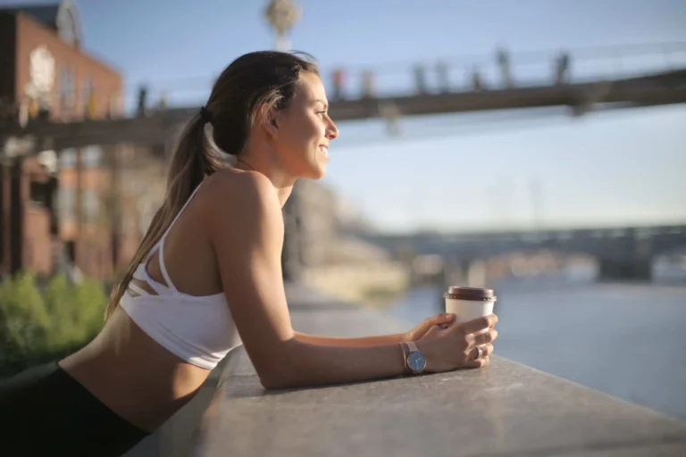 fitness woman holds coffee