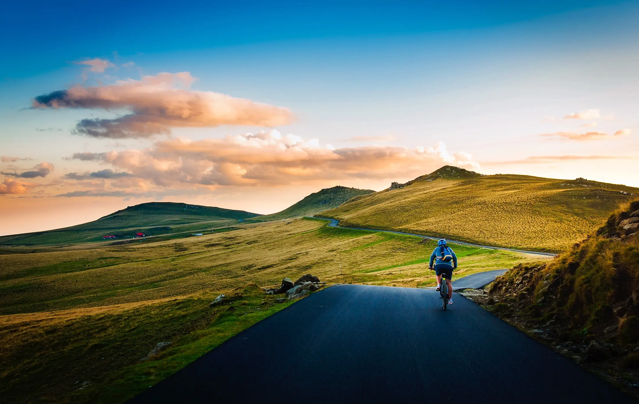 Man cycles up to mountains