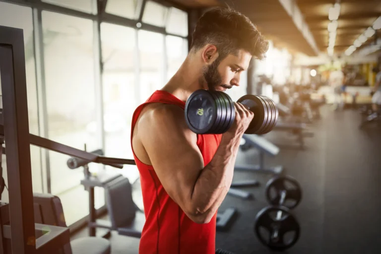 man lifting dumbbell