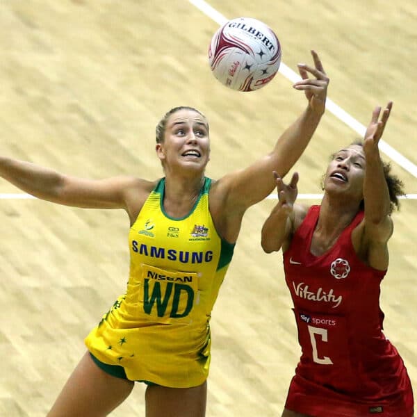 netball players jump for ball