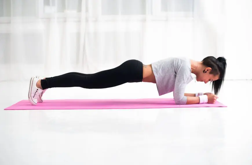 woman holds a plank scaled
