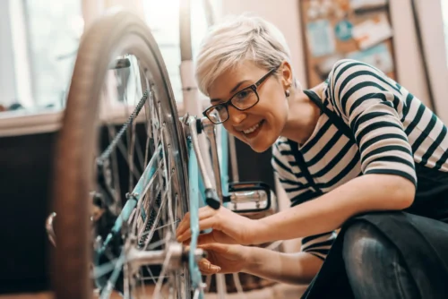 woman looking at bike scaled