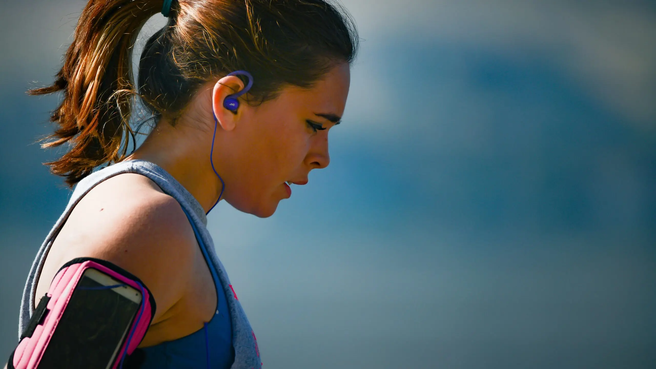 Woman looks out of breath after running scaled
